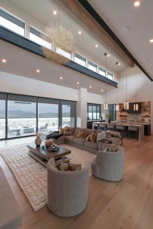 Modern kitchen with wood flors and smart Lutron lighting and shades