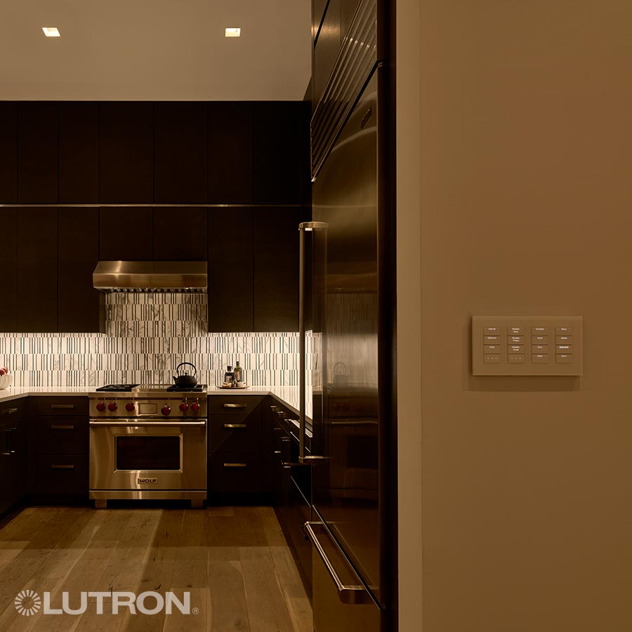 Modern kitchen with ambient lighting and a smart wall control panel