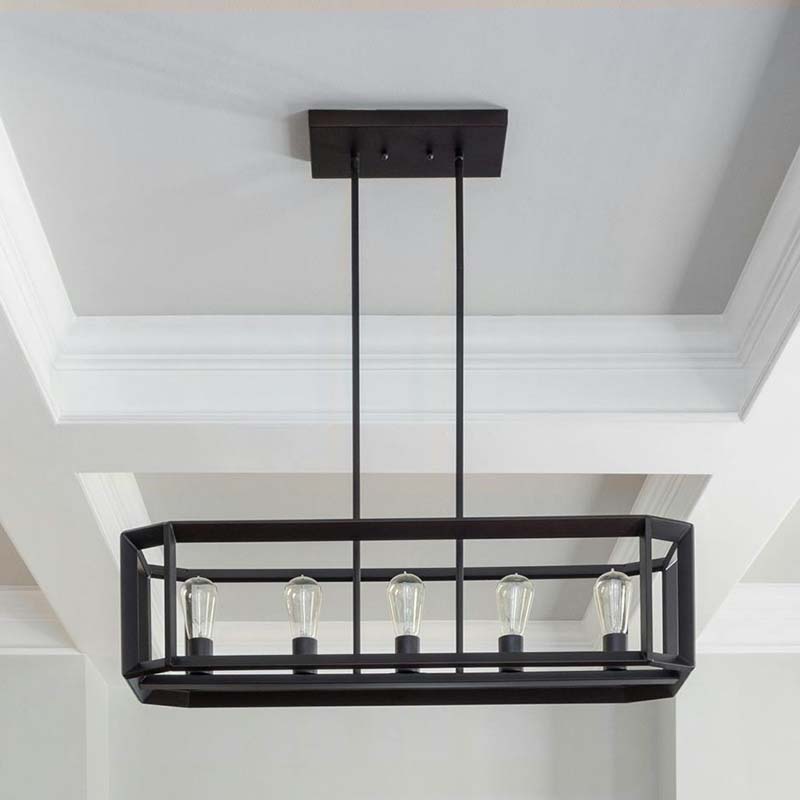 A suspended rectangular cage-style chandelier featuring multiple bulbs, installed in a spacious entryway or dining area.