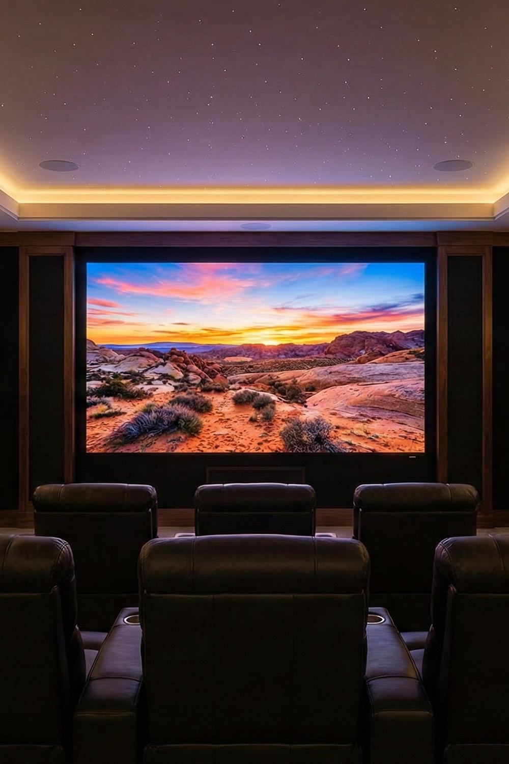 Luxury home cinema with starry ceiling and desert sunset on screen