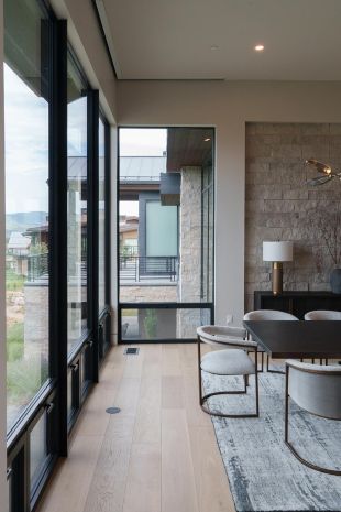 Speakers in wooden floor in a modern dining room