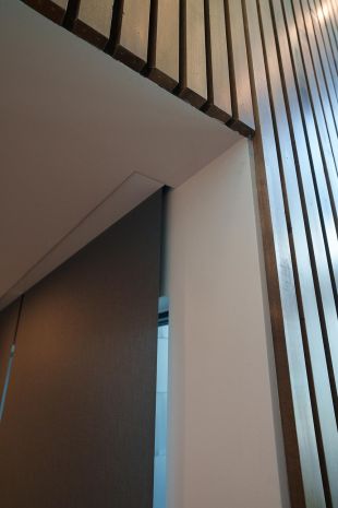 Modern house staircase with hidden Lutron Palladiom Shades details