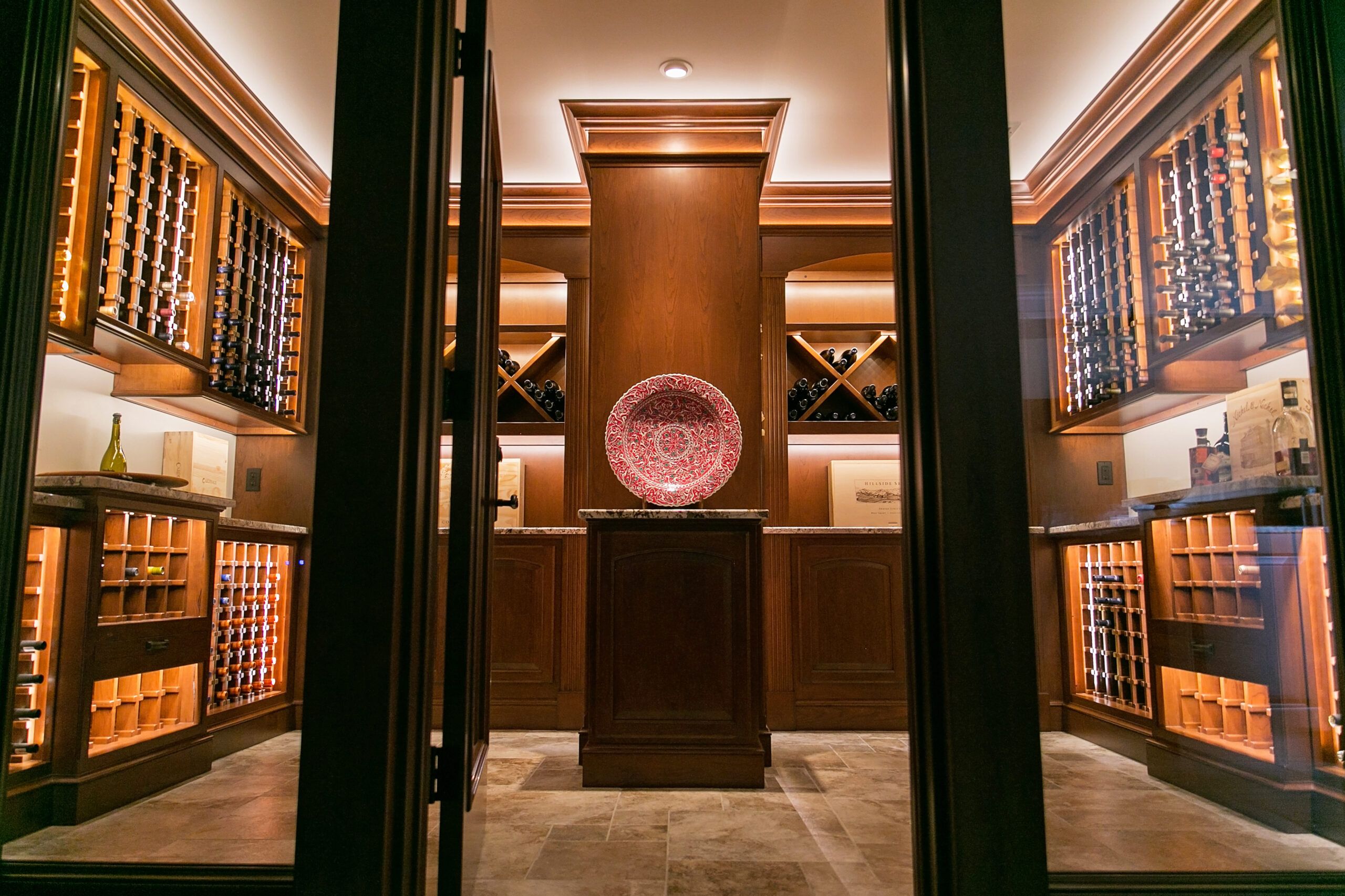 Stylish wine cellar with accent lighting on bottles.