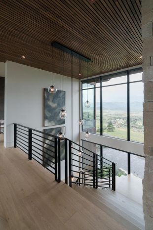 Modern house staircase with Lutron Lighting control keypad and modern glass lighting fixtures