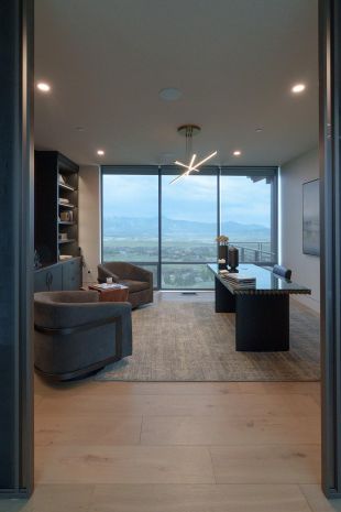 Modern home office with in-ceiling speakers and Lutron smart lighting technology