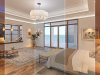 Brightly lit bedroom with coastal views, elegant decor, and modern lighting effects.