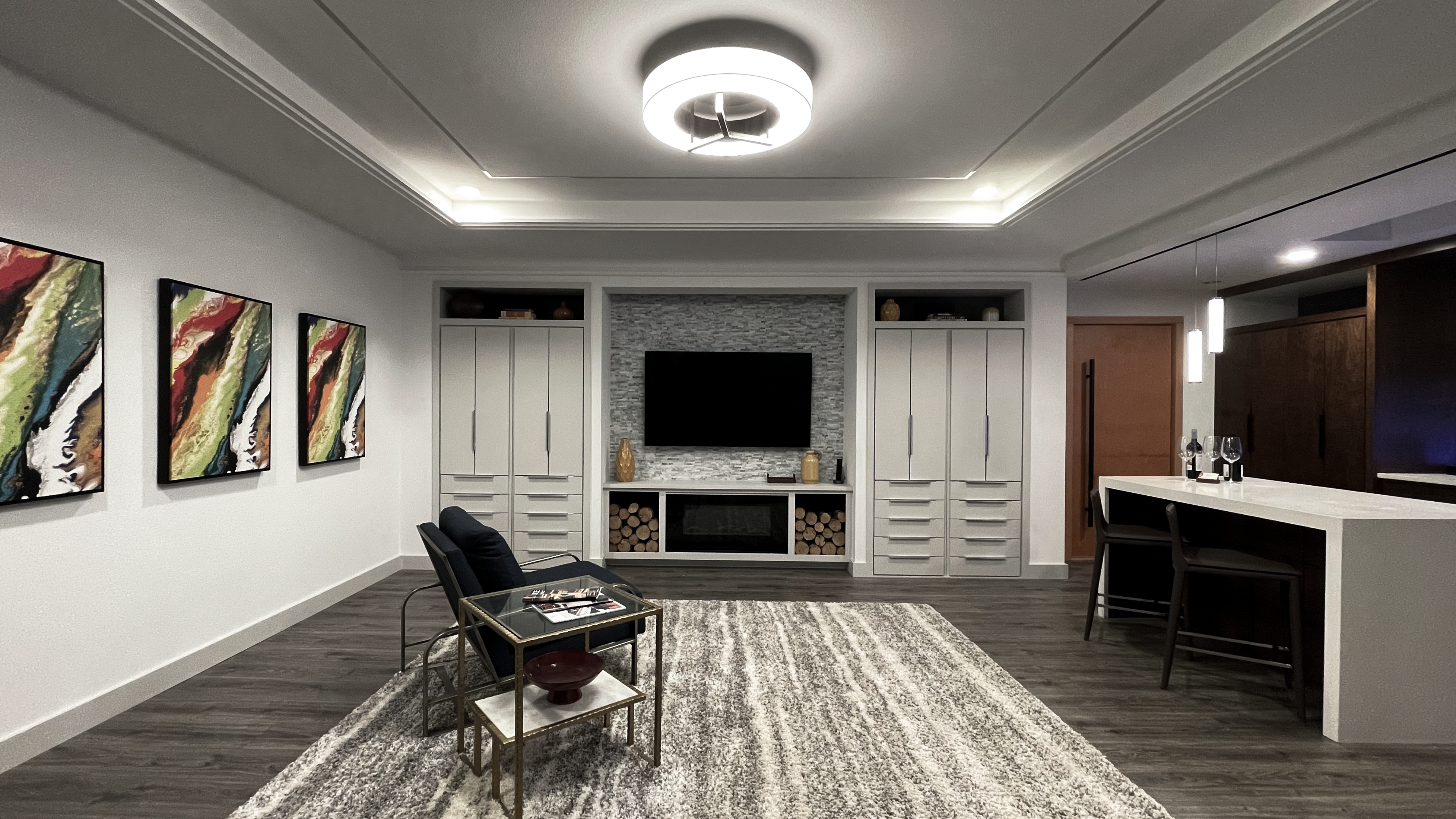 Before image of a modern living area with muted lighting and minimal decor.